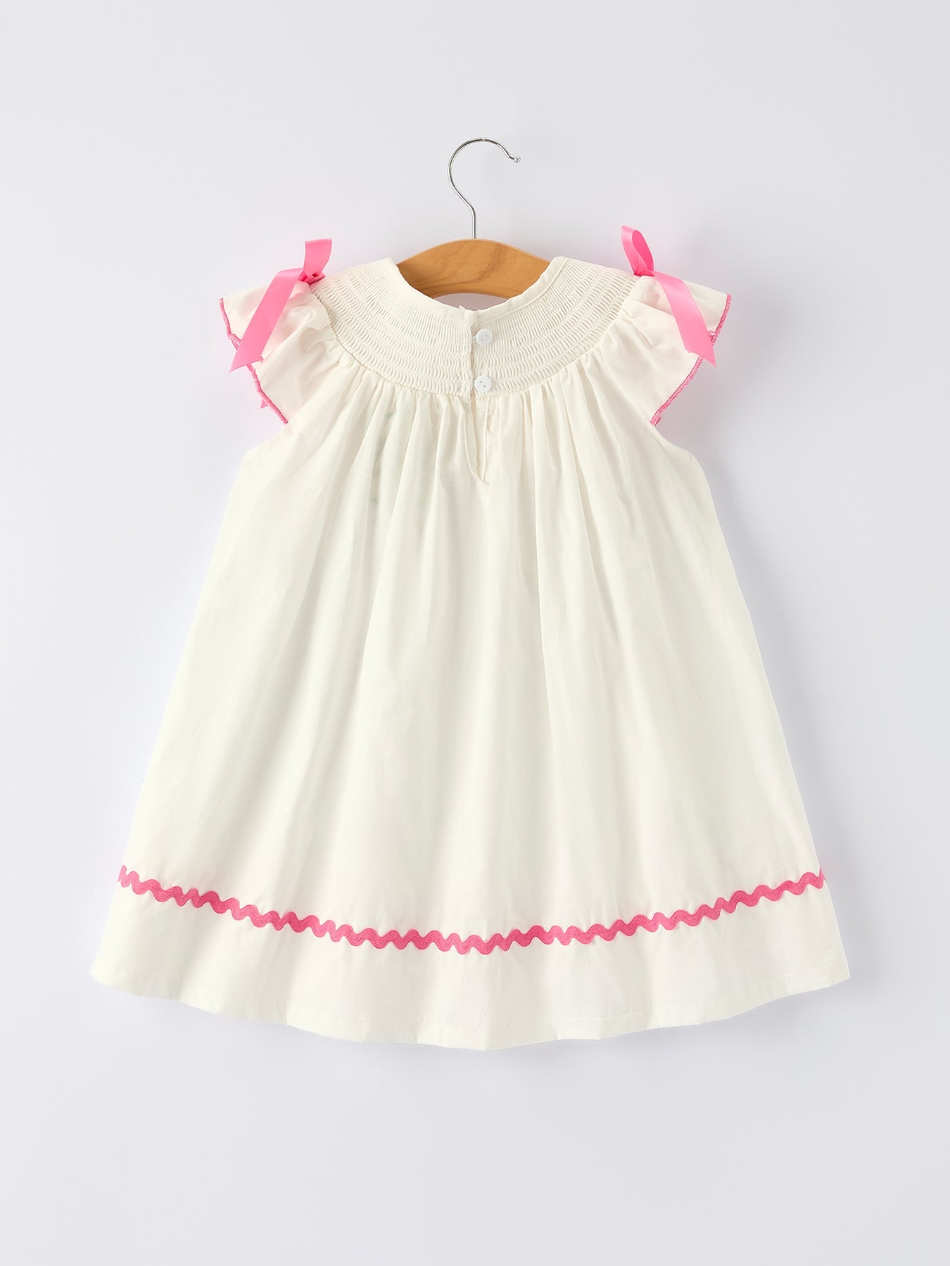 Vestido blanco de otoño para niña con bordado de lazo rosa