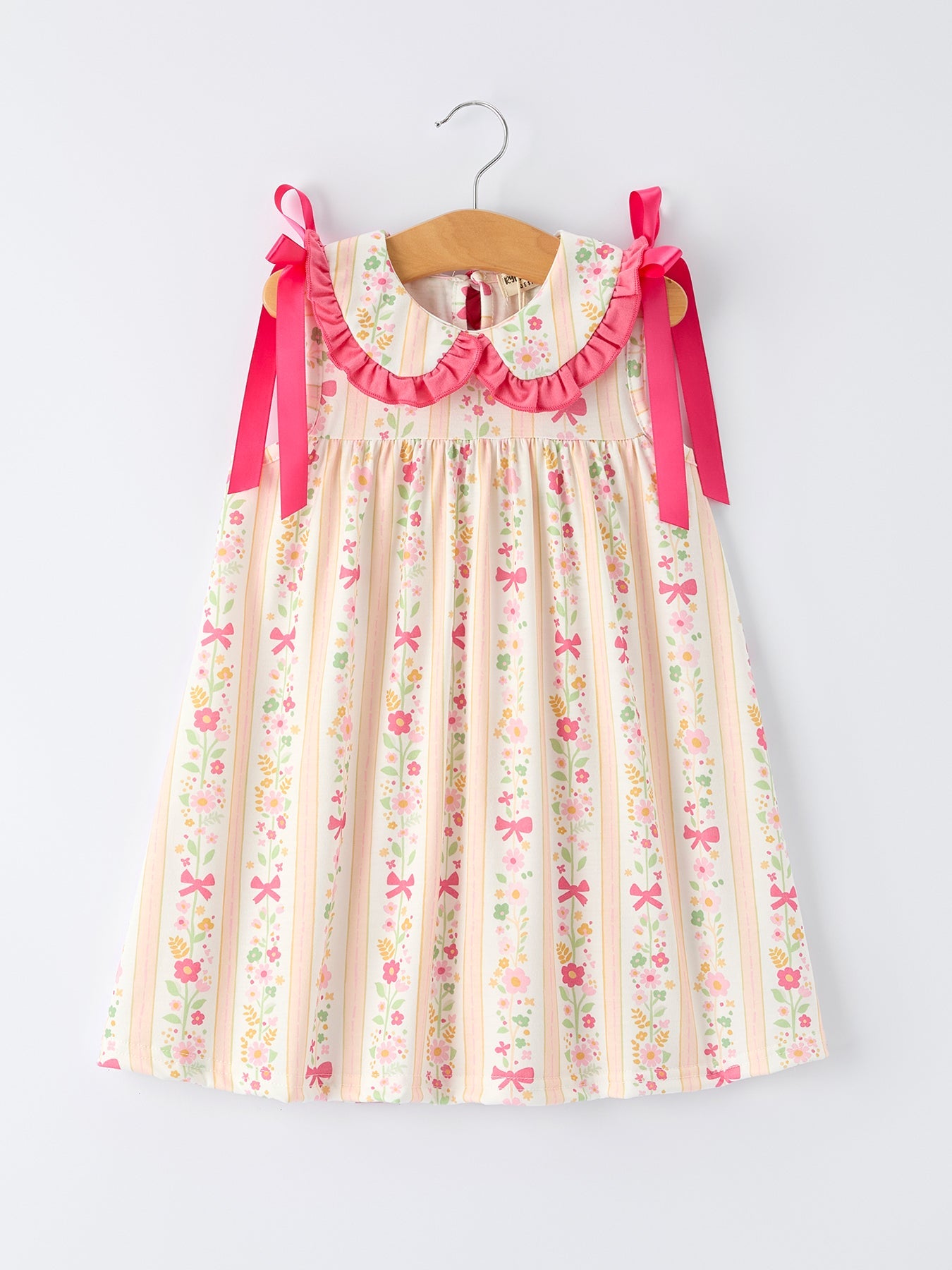 Vestido de niña con volantes y lazo floral de verano