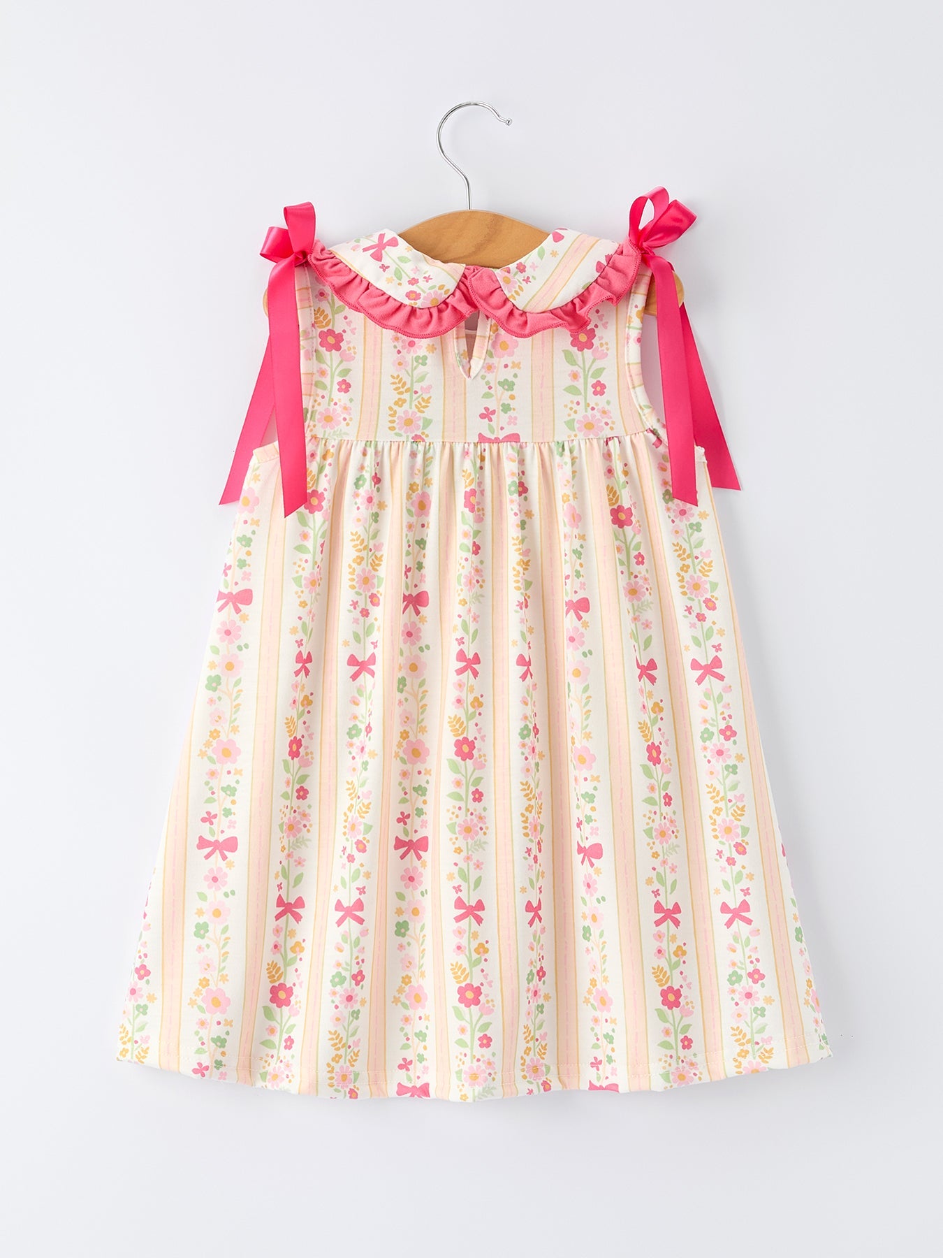 Vestido de niña con volantes y lazo floral de verano