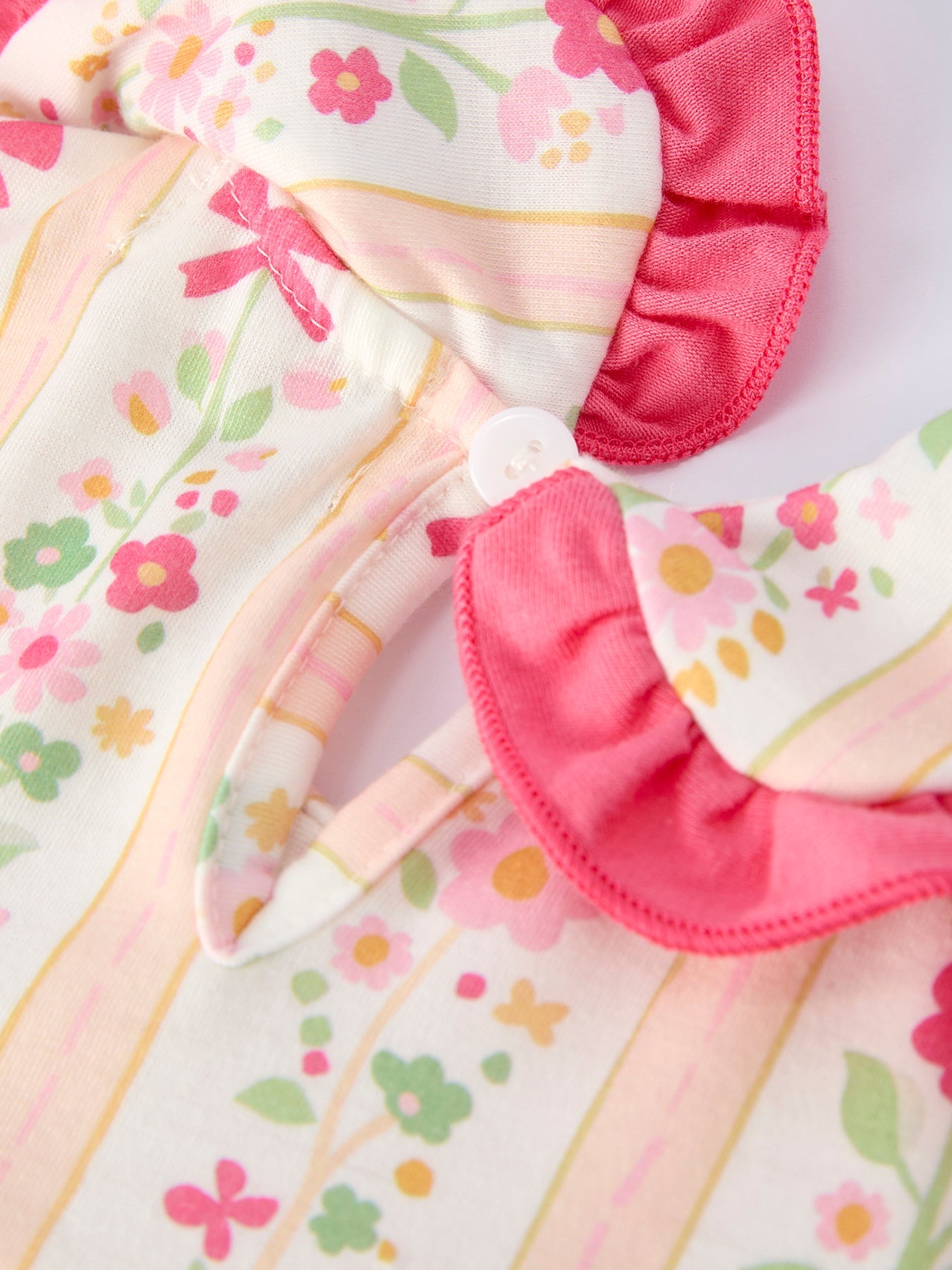 Vestido de niña con volantes y lazo floral de verano