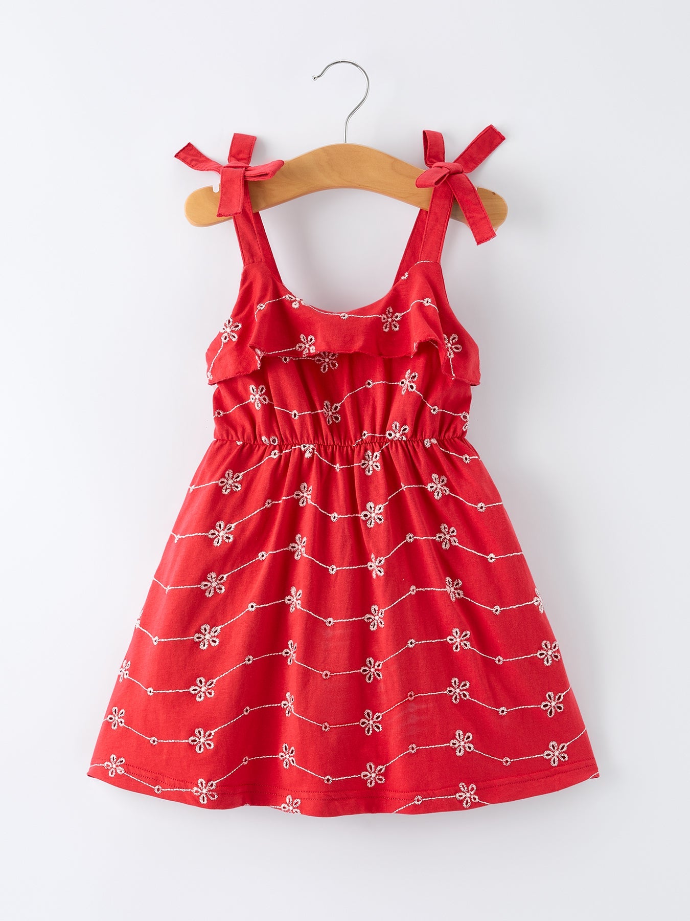 Vestido de volantes con lazo y tirantes de niña en color rojo